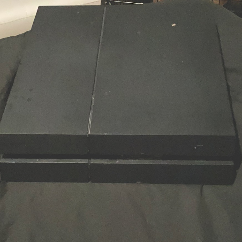 PlayStation 4 with two controllers